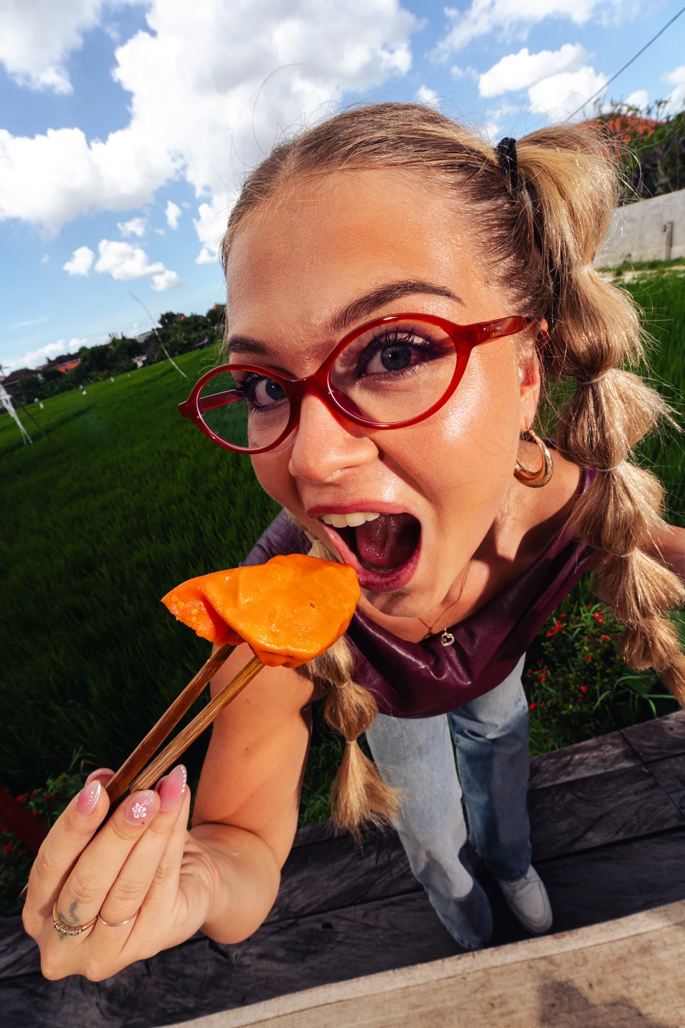 Dumpling held up with chopsticks